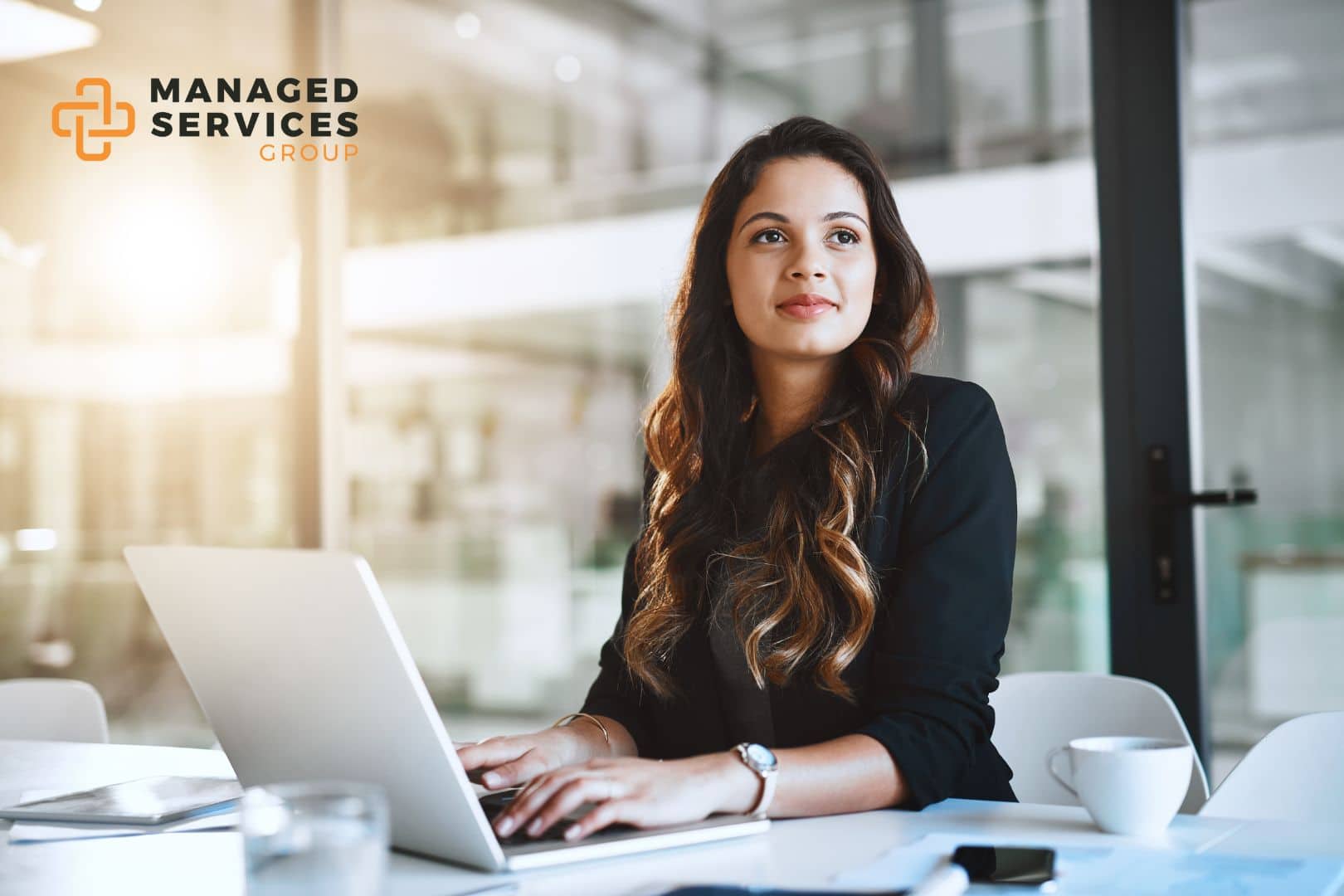 Managed Services Group - Woman using laptop