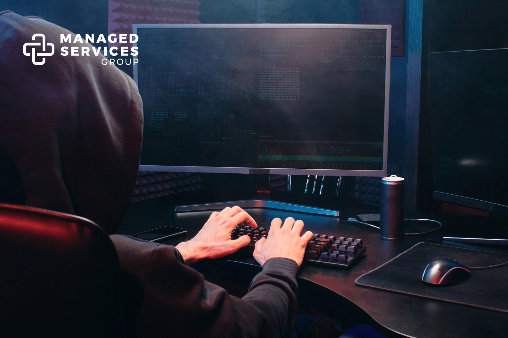 Managed Services Group - Hacker on computer