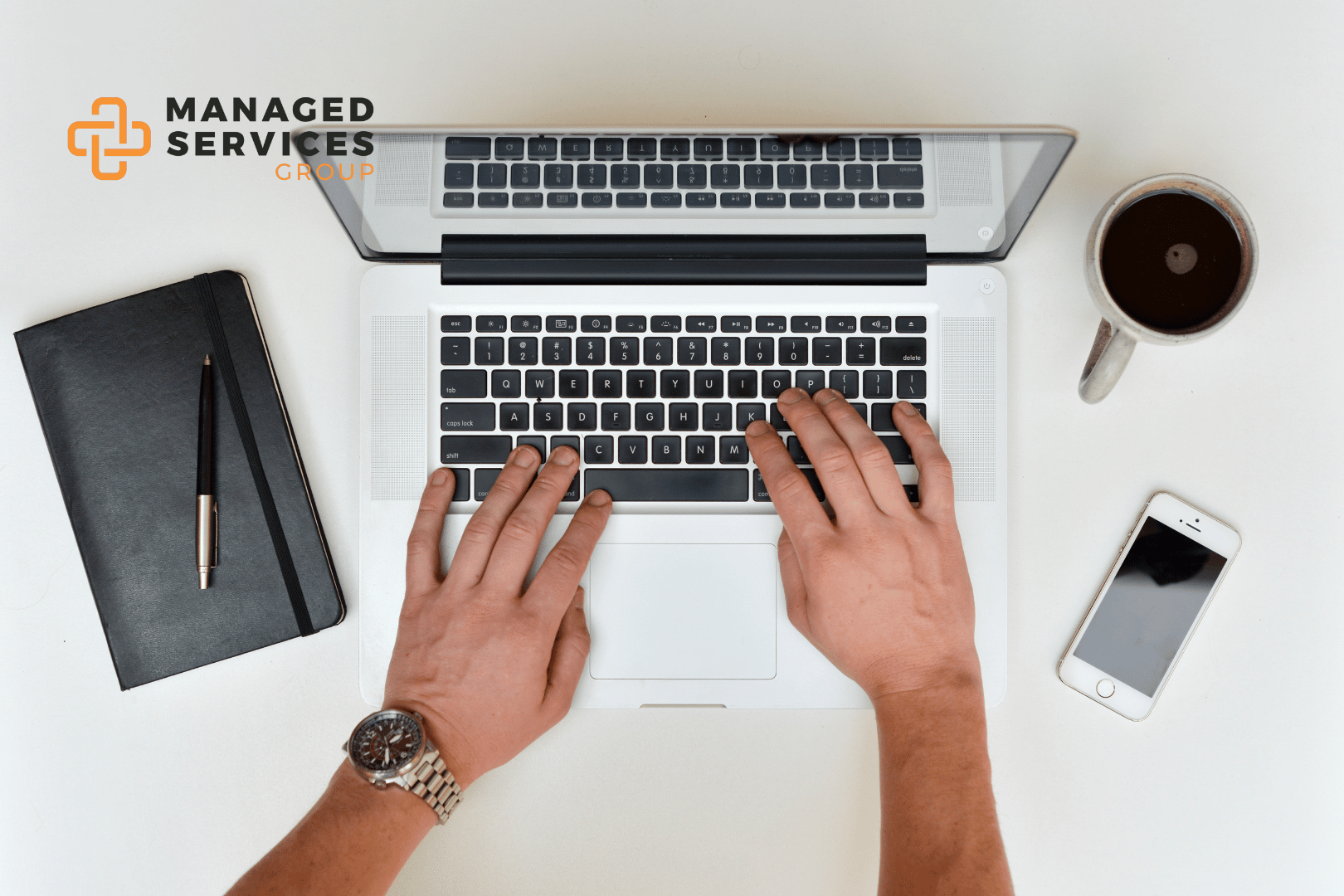 Managed Services Group - Typing on laptop