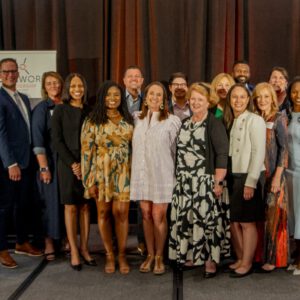 Smiling team photo at an event