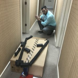 Playing putt putt on a self made hole made from box scraps