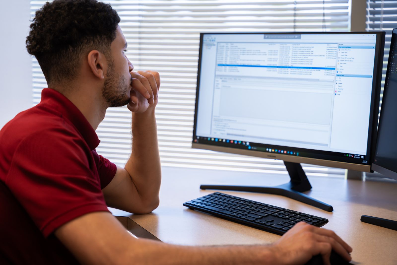 team member focused on computer screen