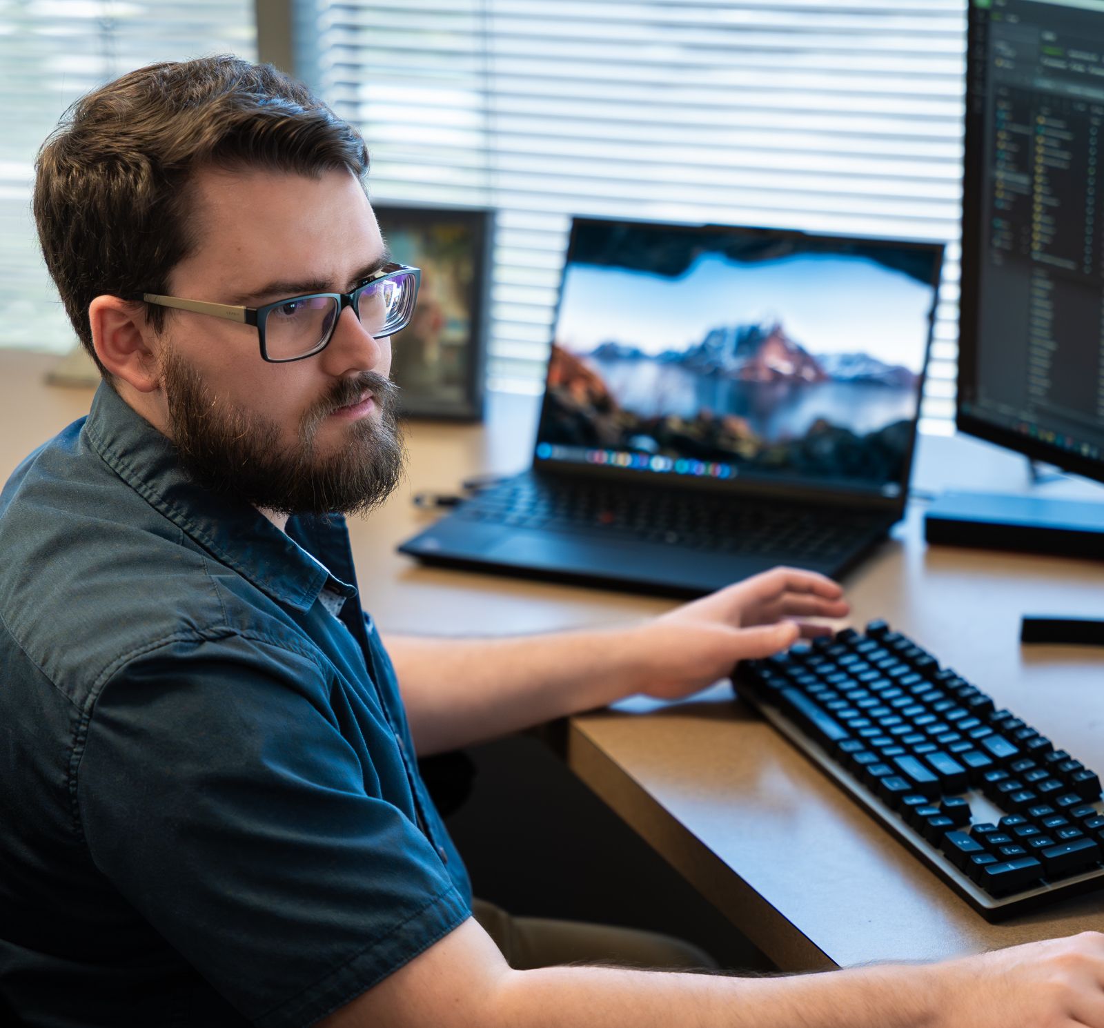 team member looking at computer screens